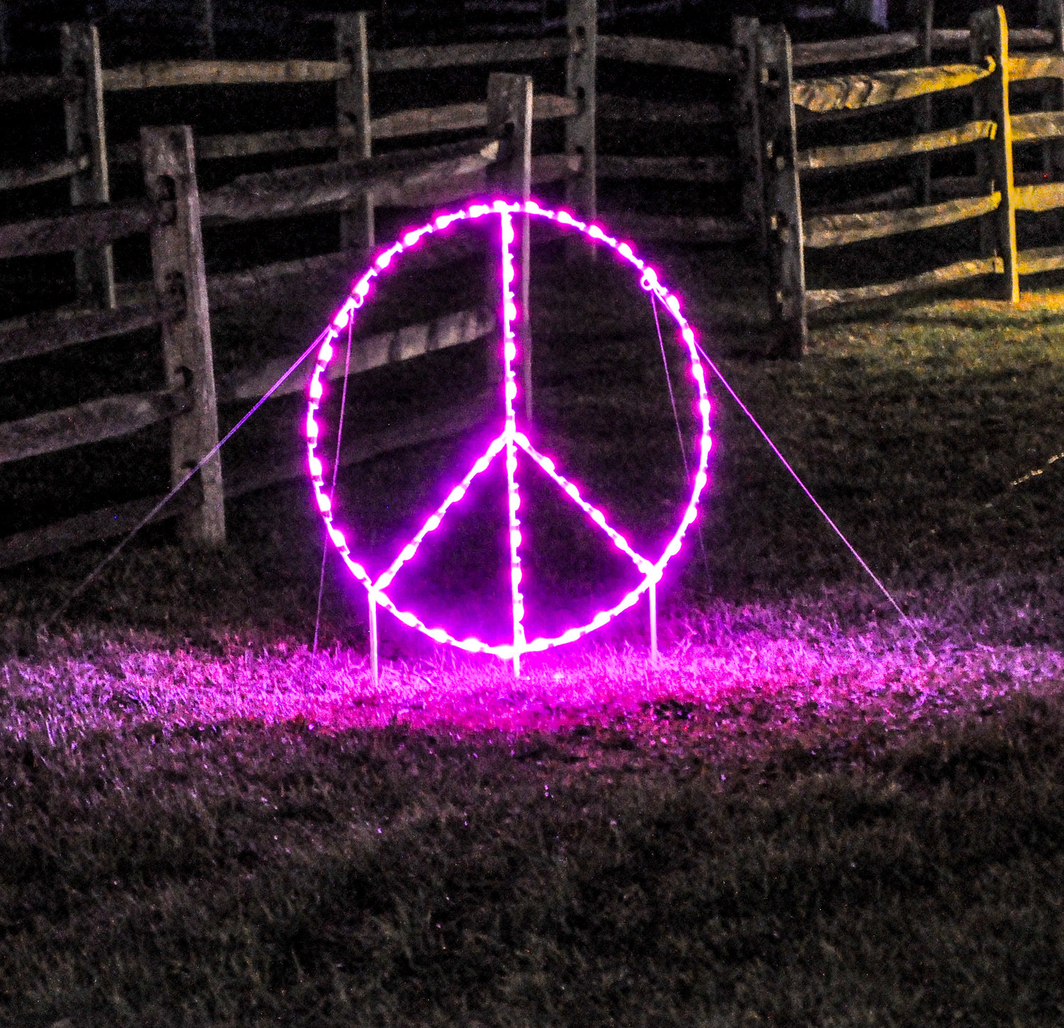 What would a holiday-themed light show at Bethel Woods be without a peace sign and hippie van lining the route?